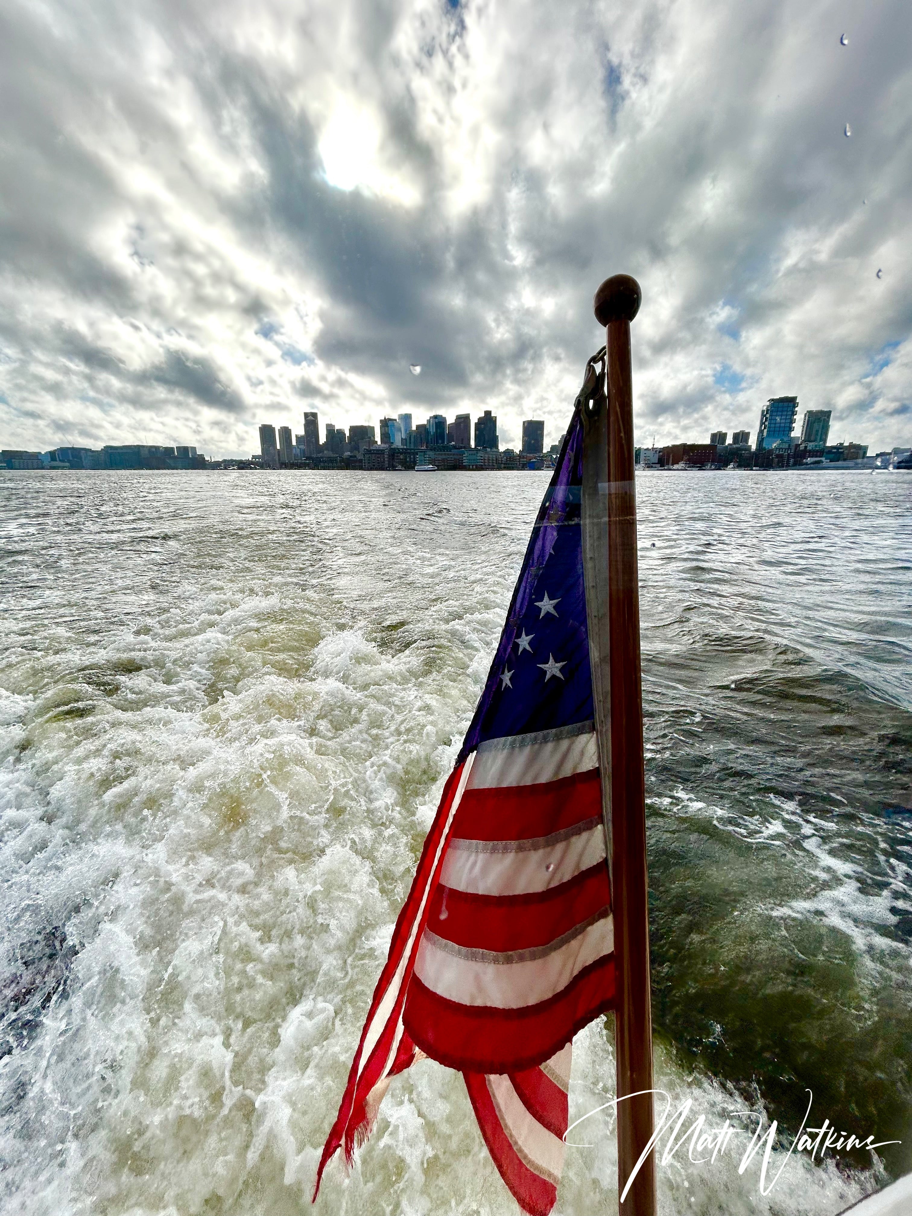 Boston harbor with American Flag