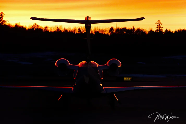 Sunset capturing silhouette of a business jet in Bangor